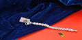 A silver-toned chain bracelet with a textured woven pattern for kid