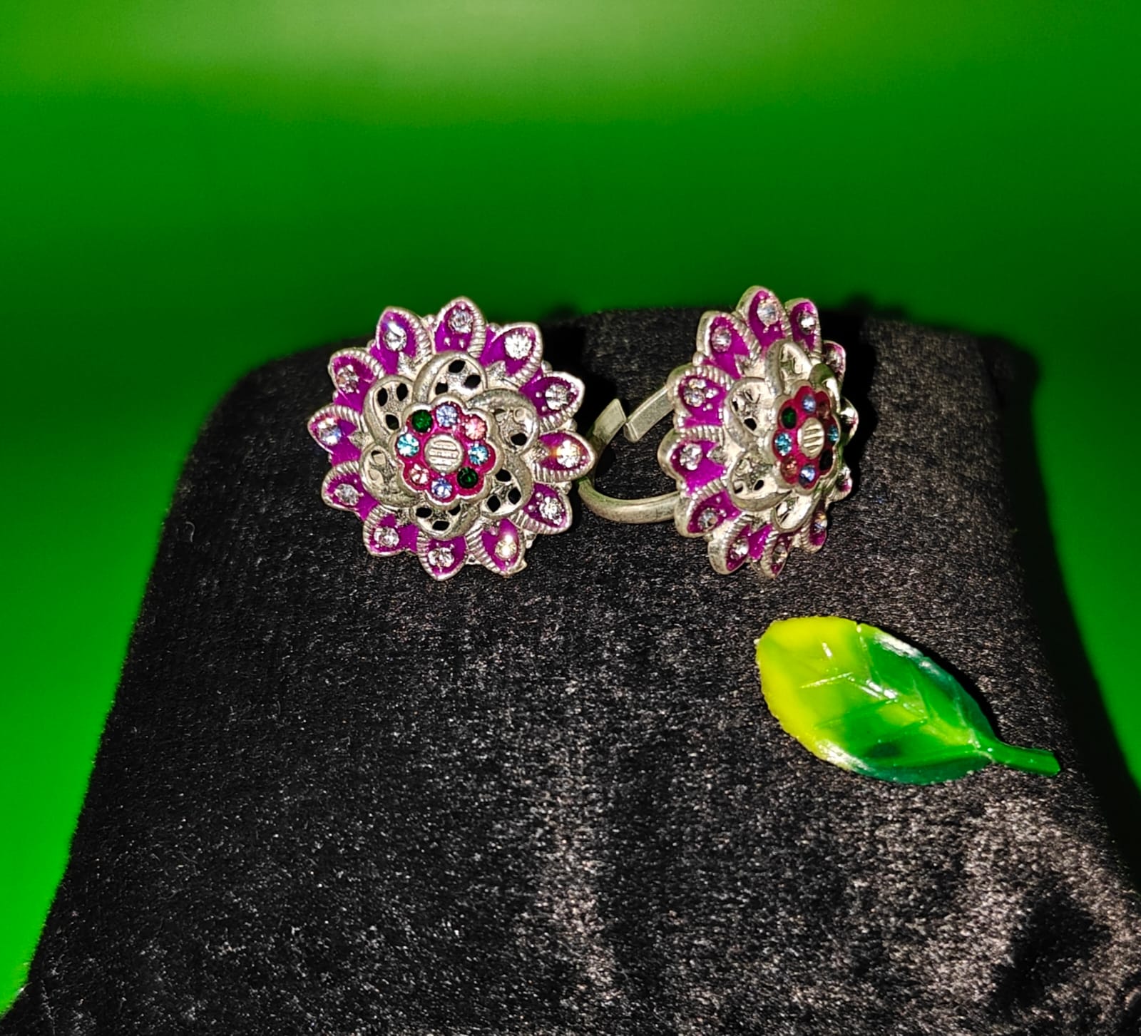  silver rings with intricate floral designs set with multi color stones